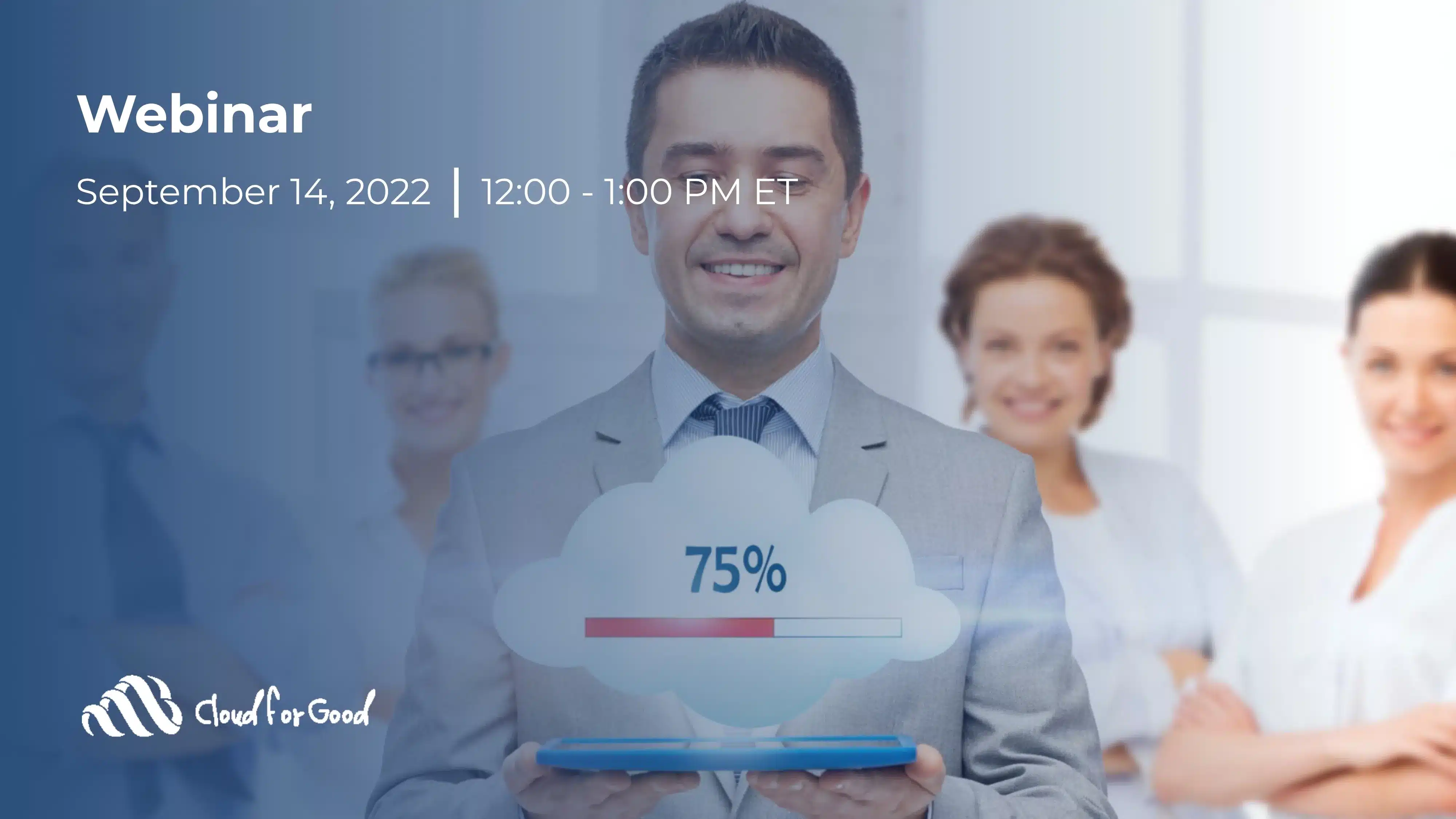 Smiling businessman holding a tablet with a glowing cloud graphic and 75% progress bar, colleagues blurred in the background
