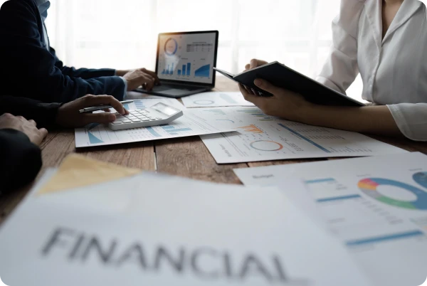 Financial team reviewing charts and analytics for Salesforce CRM strategy