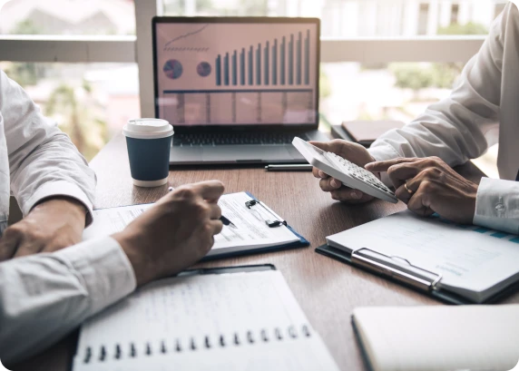 Wealth management advisors reviewing financial charts and analytics for client portfolio planning