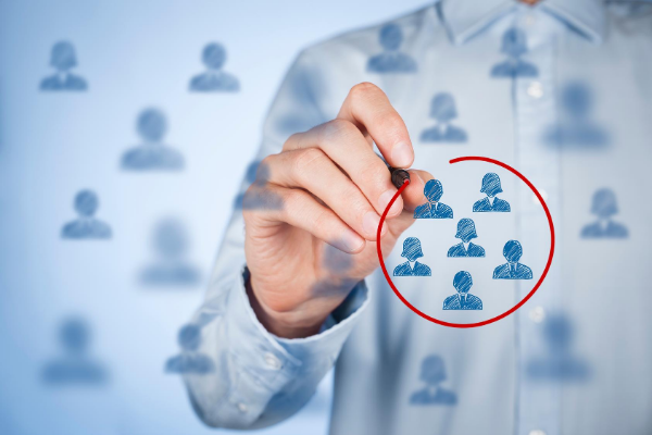 Person selecting audience segments and target groups on a digital interface