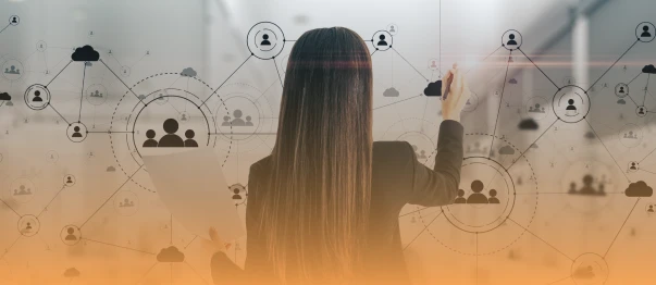 Woman pointing at a digital network of people and cloud icons while holding a folder