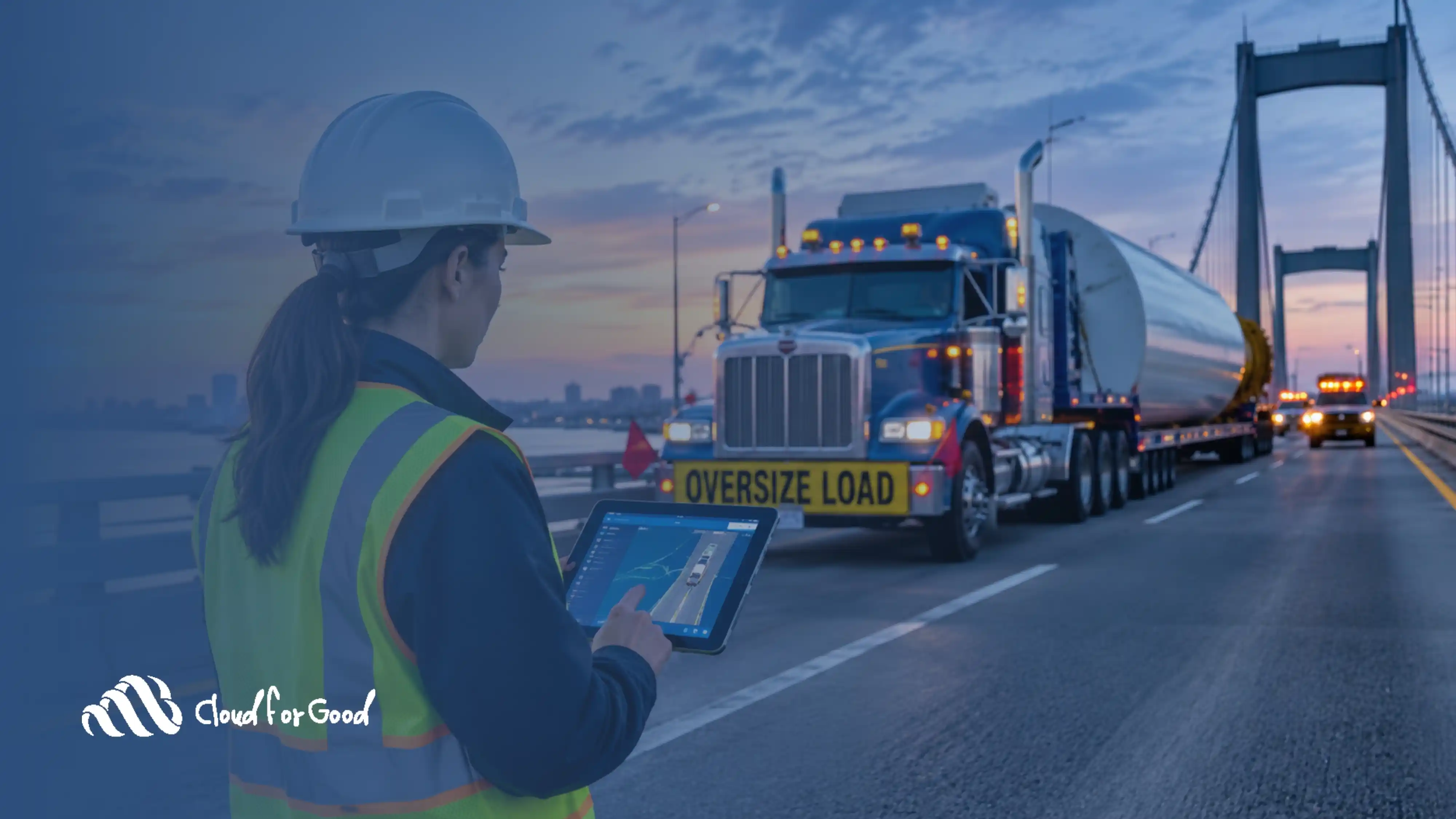 A Department of Transportation field inspector in a hi-vis vest on a bridge with a tablet, an oversize-load truck in the background, representing modernized field operations.